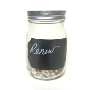 A glass jar with a chalkboard label reading 'Renew'.