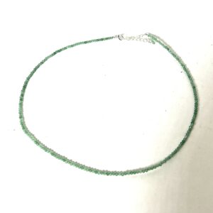A delicate green beaded necklace with a silver clasp.